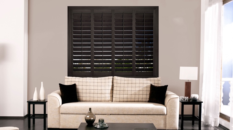 San Diego sitting room with stained wood shutters.